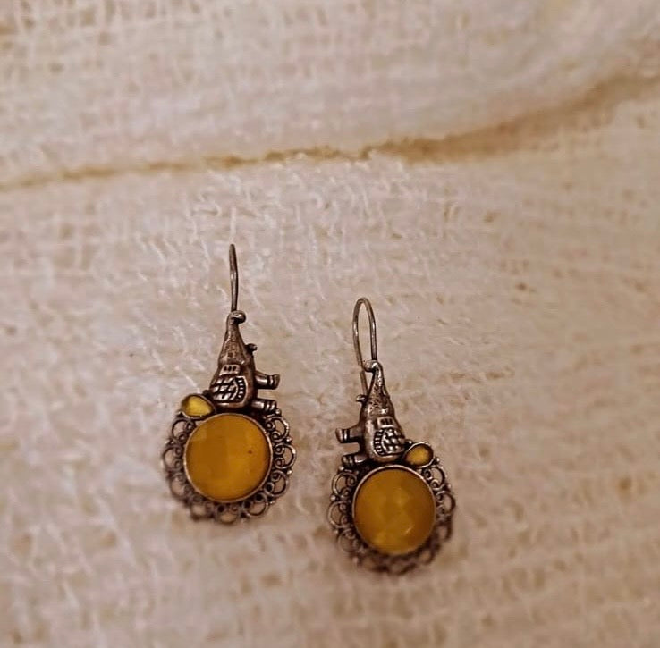 Rustic Grace: Yellow Stone Drop Earrings with Antique Silver Parrot Motif