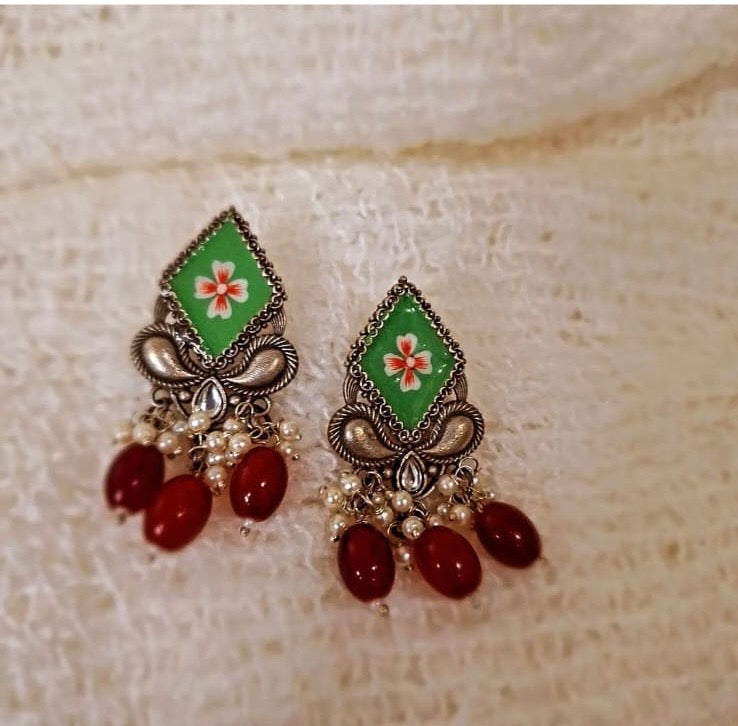 Handcrafted Heritage: Elegant Green & Silver Earrings with Floral Enamel and Red Beads
